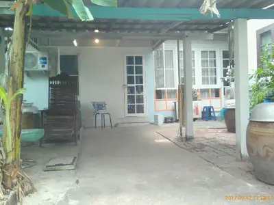 an open patio with a table and chairs in a house at Social Style Culture in Bangkok