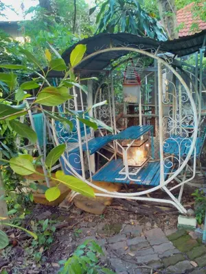 a gazebo with a chair and a table at Social Style Culture in Bangkok