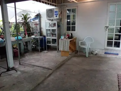 a garage with a table and a desk in it at Social Style Culture in Bangkok
