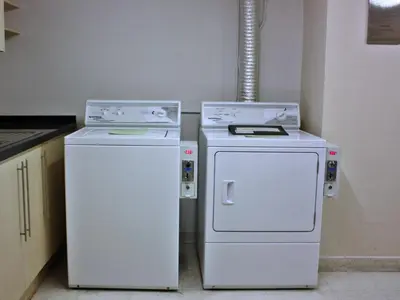 two white appliances sitting next to each other in a kitchen at Centre Point Sukhumvit Thong-Lo in Bangkok