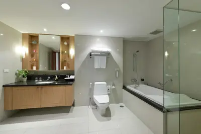 a bathroom with a toilet and a sink and a bath tub at Centre Point Sukhumvit Thong-Lo in Bangkok