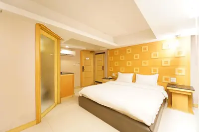 a bedroom with a large bed in a room at UPAR Hotels Sukhumvit 11 Nana in Bangkok