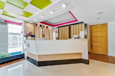 a lobby with a reception desk in a building at UPAR Hotels Sukhumvit 11 Nana in Bangkok