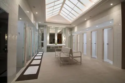 a hallway with a skylight in a building at Rama Gardens Hotel Bangkok in Bangkok