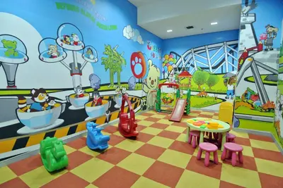 a childrens play room with a checkered floor at Somerset Park Suanplu Bangkok in Bangkok