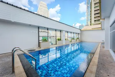 a swimming pool on the side of a building at Citadines Sukhumvit 16 Bangkok in Bangkok