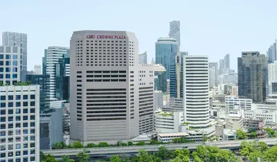 a city skyline with tall buildings and a freeway at Crowne Plaza Bangkok Lumpini Park by IHG in Bangkok