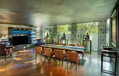 a large living room with a large table and chairs at TUI BLUE Maduzi Hotel Bangkok in Bangkok