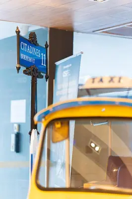 a yellow taxi cab with a sign on top of it at Citadines Sukhumvit 11 Bangkok in Bangkok