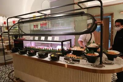 a buffet line with food on top of it at Centara Grand At CentralWorld in Bangkok