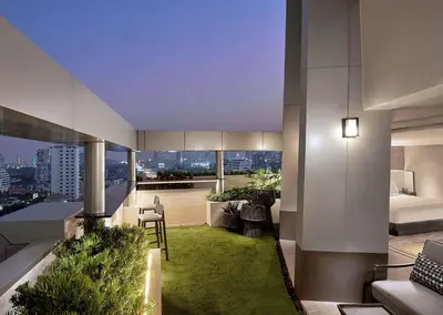 a hotel room with a view of the city at DoubleTree by Hilton Bangkok Ploenchit in Bangkok