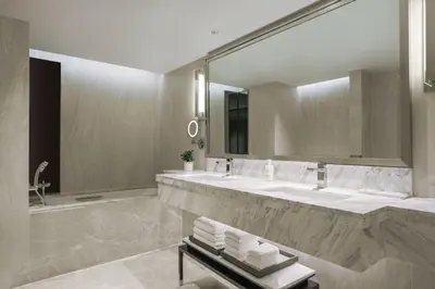 a bathroom with two sinks and a large mirror at JW Marriott Hotel Bangkok in Bangkok