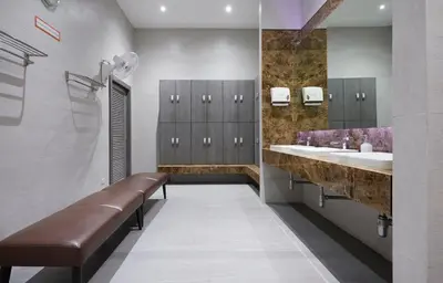 a bathroom with two sinks and two mirrors at The Four Wings Hotel Bangkok in Bangkok