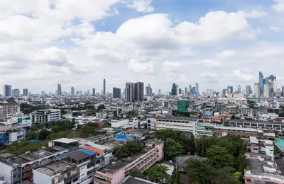 a cityscape of a city with tall buildings at Chatrium Sathon Bangkok in Bangkok