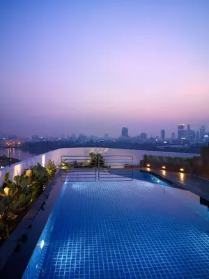 a swimming pool on the roof of a building at NH Bangkok Asoke in Bangkok