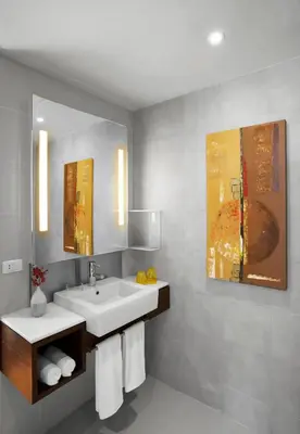 a bathroom with a sink and a mirror at NH Bangkok Asoke in Bangkok
