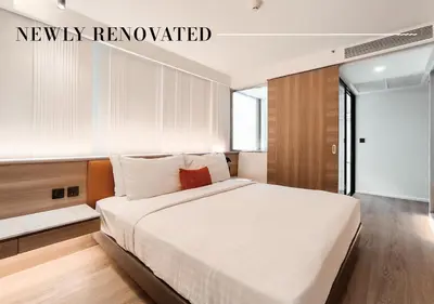 a bedroom with a large white bed in a room at Citrus Sukhumvit 13 Nana Bangkok by Compass Hospitality - Newly Renovated in Bangkok