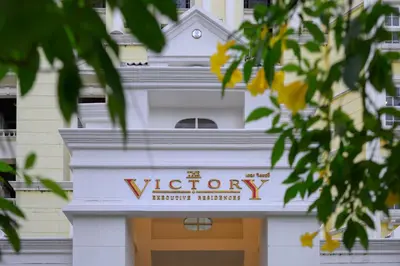 a building with a sign for the victory historic pharmacy at The Victory Residences Bangkok in Bangkok