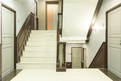 a hallway with stairs in a building at Bangkok Loft at Nana Station in Bangkok