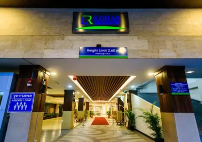 a hotel lobby with a sign that reads rhodas insurance at Lohas Residences Sukhumvit 2 in Bangkok
