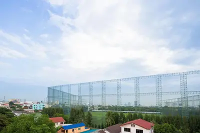 a large glass building with a large window at Twentynine KV Apartel in Nonthaburi