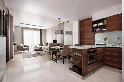 a kitchen and living room with a dining room at Bangkok Marriott Hotel The Surawongse in Bangkok