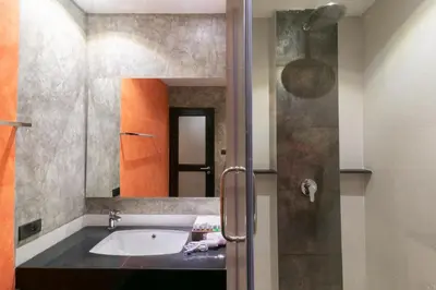 a bathroom with a sink and a mirror at Zleepmotion Bangkok in Bangkok