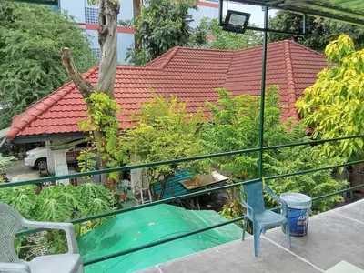 a view from the balcony of a house with a swimming pool at Young and Beautiful in Bangkok