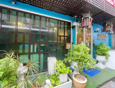 a store front with plants in front of it at Arawana Express Chinatown in Bangkok