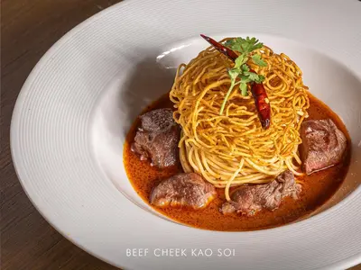a bowl of spaghetti and meatballs on a plate at AETAS lumpini in Bangkok