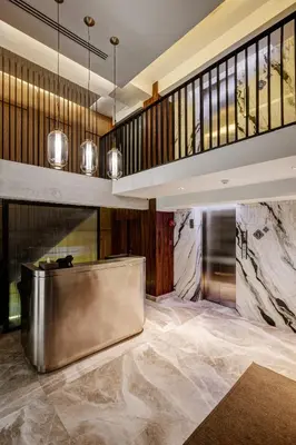 a lobby with a staircase and a stainless steel bench at Sib Kao in Bangkok