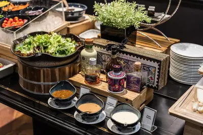 a buffet with food and drinks on a table at MUU Bangkok, Small Luxury Hotels of the World in Bangkok