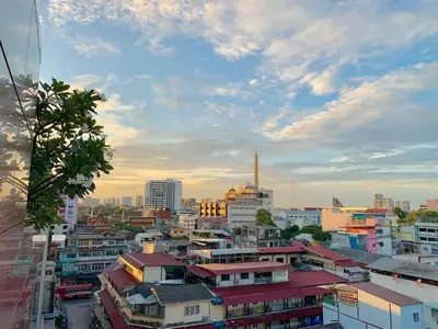 a cityscape of a city with buildings and a sky at Nouvo City Hotel in Bangkok