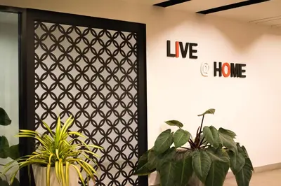 a room with plants in front of a door at Live at Home Sukhumvit 105 in Bangkok