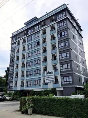 a large apartment building with a sign on it at Live at Home Sukhumvit 105 in Bangkok