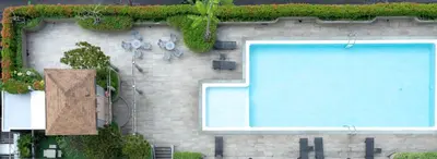 a swimming pool on the side of a building at BU Place Hotel in Bangkok