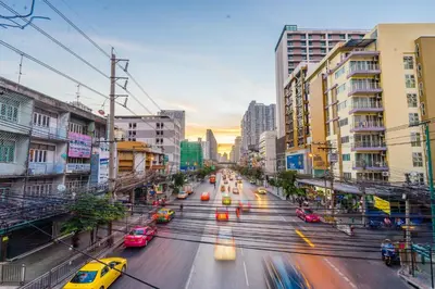 a busy city street with cars on the road at Samran Place Hotel in Bangkok