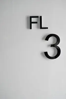 a white wall with the number on it at S44ROOM in Bangkok