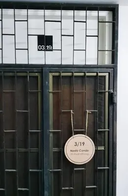 a sign on the door of a building at Nesto Condo at Muangthong in Pak Kret
