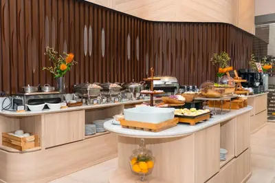 a buffet line with many different types of food at Amanta Hotel & Residence Ratchada in Bangkok