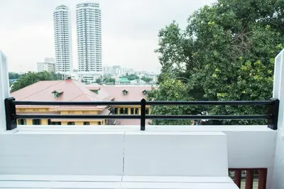 a balcony with a view of a building at Khaosan Art Hotel in Bangkok
