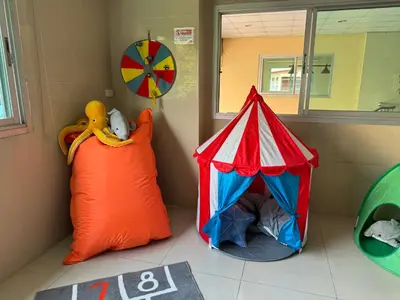 a play room with a red and blue tent and a pillow at Sivalai Place in Bangkok