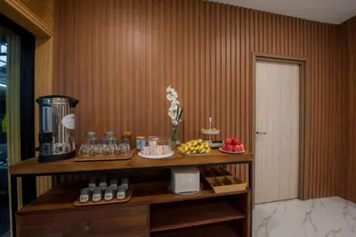 a room with a counter with fruit and a blender at The Moon Night Hotel in Bangkok