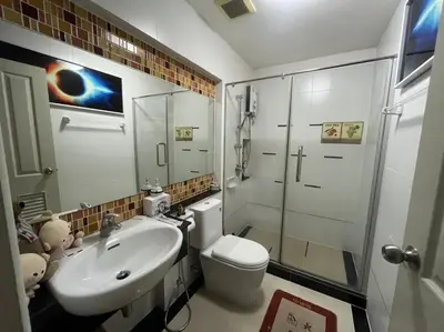 a bathroom with a sink and a toilet and a shower at Autta house in Ban Lat Tanot