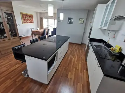 a kitchen with a sink and a counter top at Penthouse by JJ in Bangkok