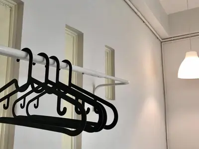 a towel rack in a room with a mirror at 12/14 HOME Studio in Bangkok