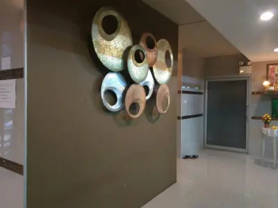 a bunch of cups hanging on a wall at Crystal Place Parkkred in Nonthaburi
