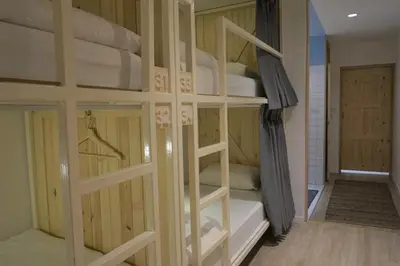 a couple of bunk beds in a room at Pinto Hostel in Bangkok