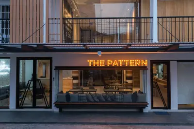 a store window with a sign that reads the kitchen at The Pattern Boutique Hotel in Bangkok