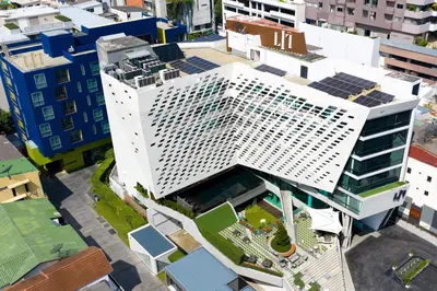 an overhead view of a white building in a city at LiT BANGKOK Hotel in Bangkok